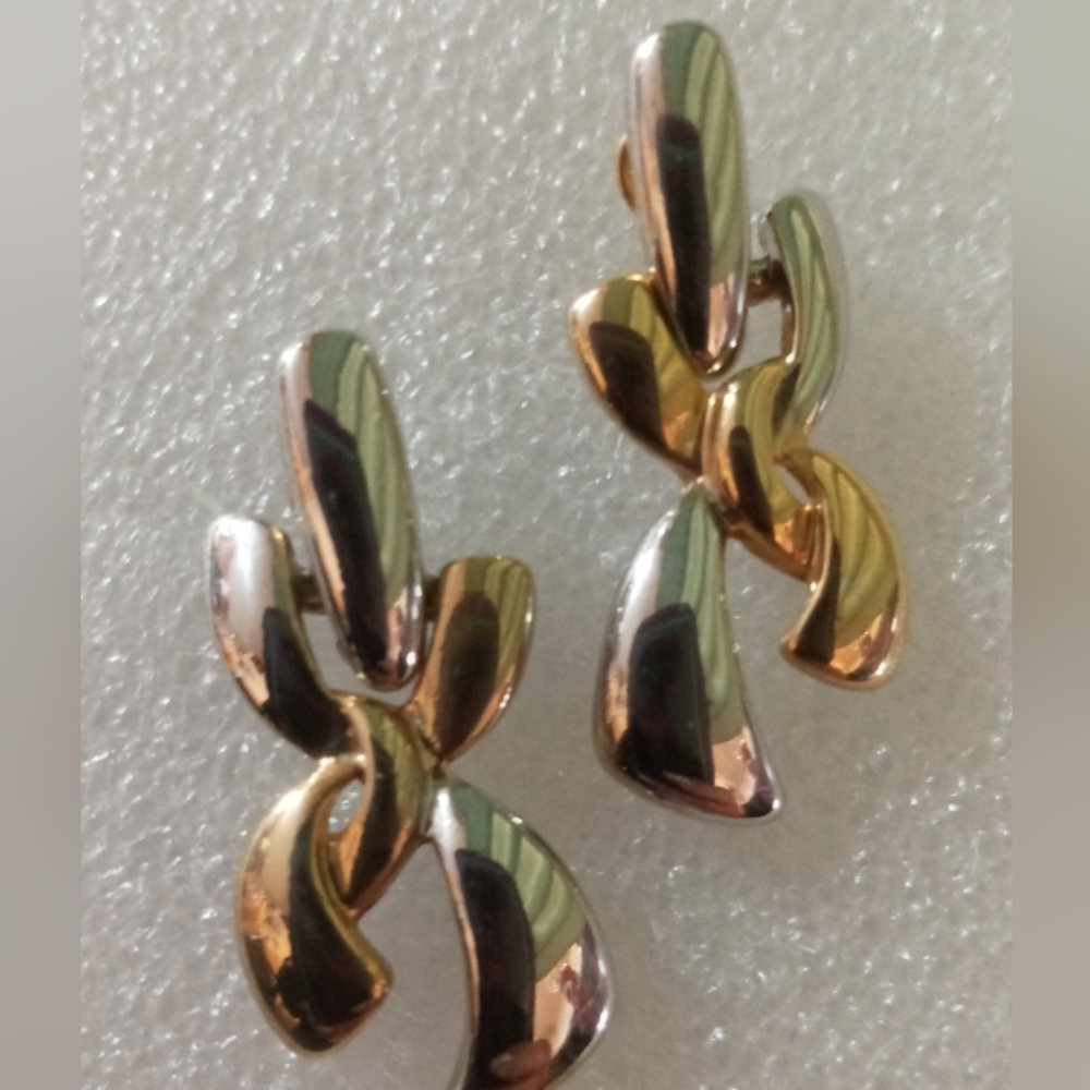 Vintage hinged gold and silver  twisted X earrings.
